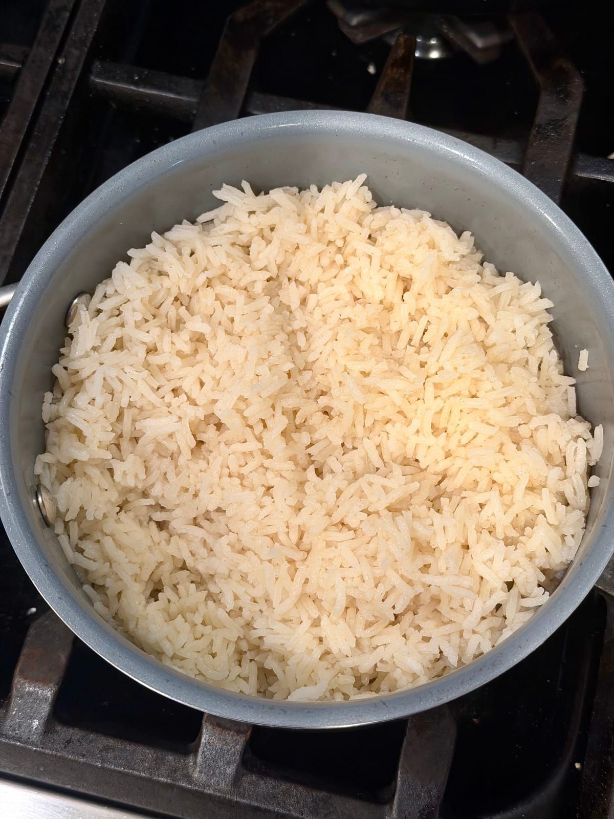 Finished aromatic basmati rice, fluffed and fluffy in the pot